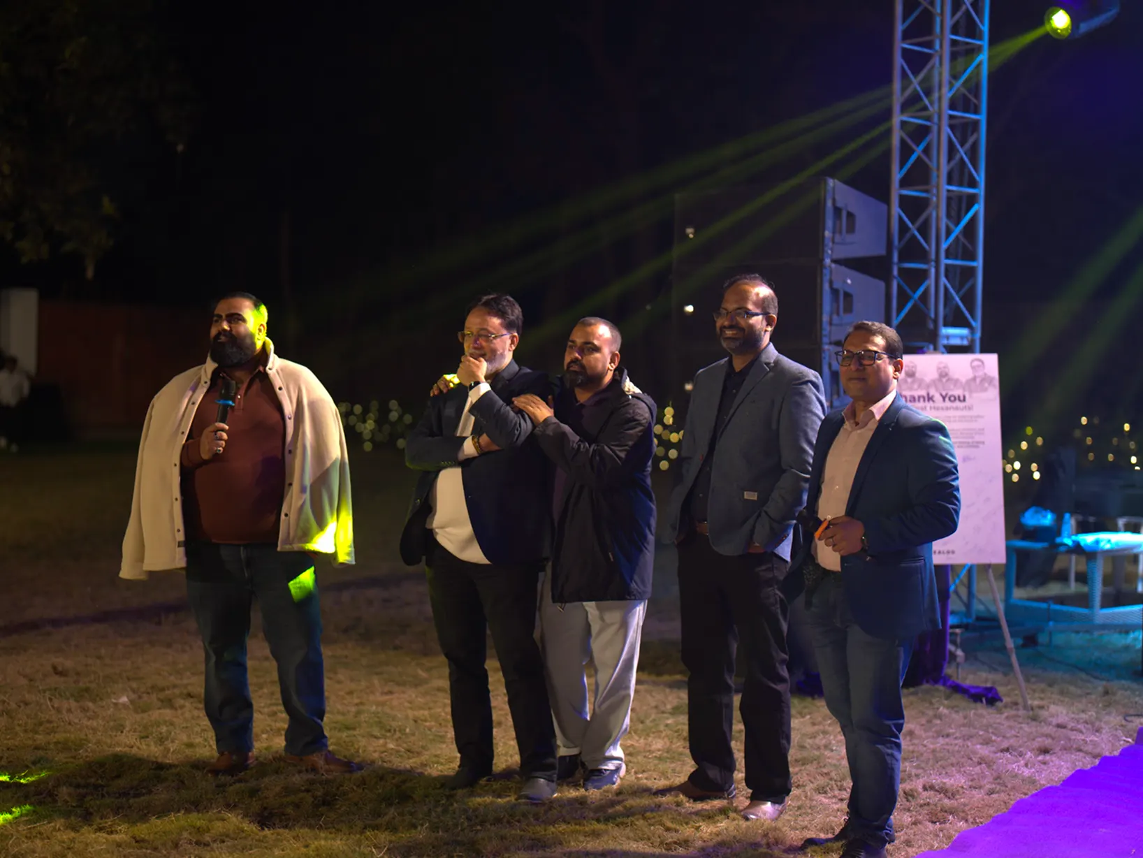 The founders and the team together outdoors at an evening gathering