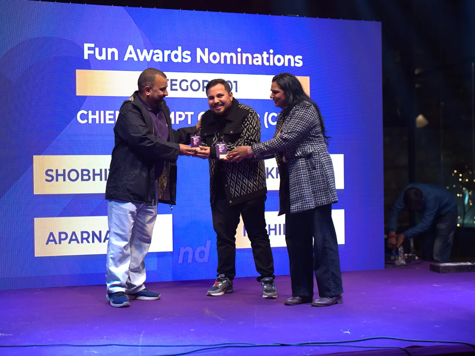 Nikhil and Shikha presenting a Fun Award on stage