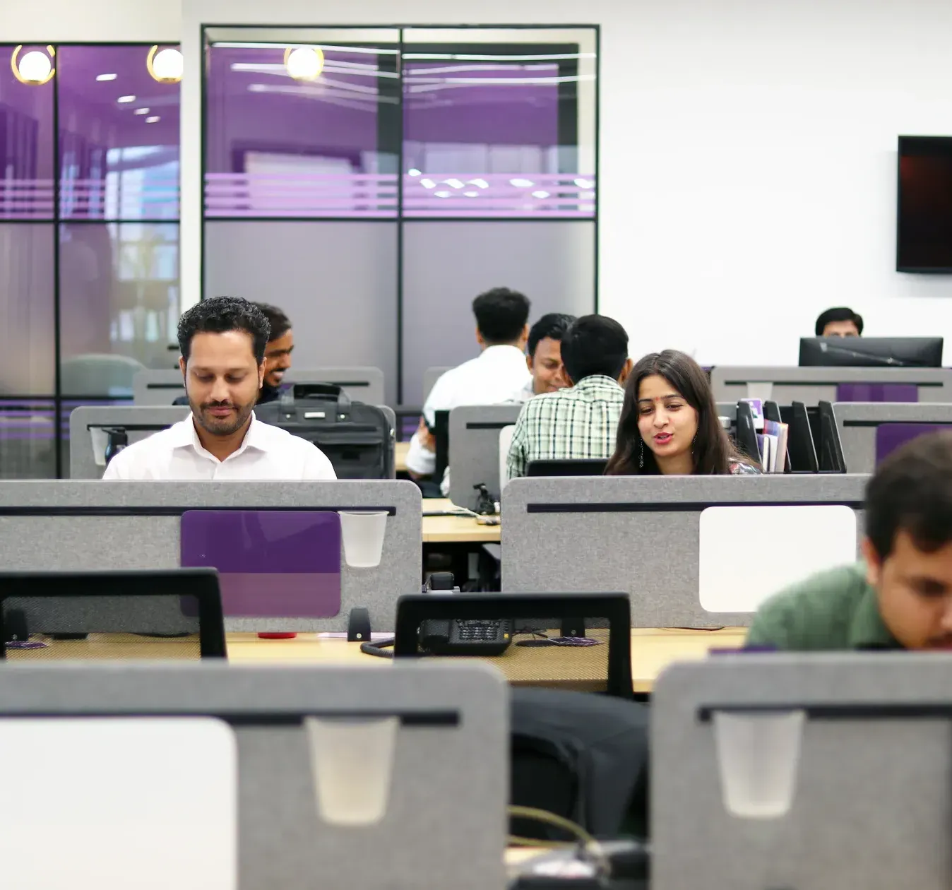 Hexalog colleagues at work in the Gurugram office