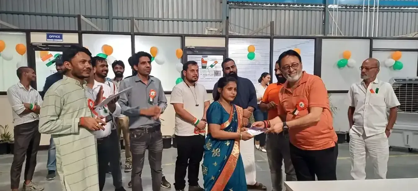 A Hexalog colleague being recognised on the warehouse floor