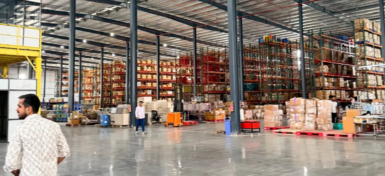 The Hexalog warehouse floor, with racking bays along the far wall